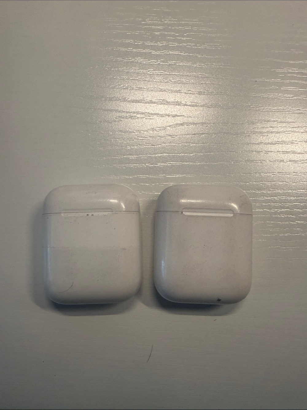 2 Apple AirPods. Chargers and pods work.